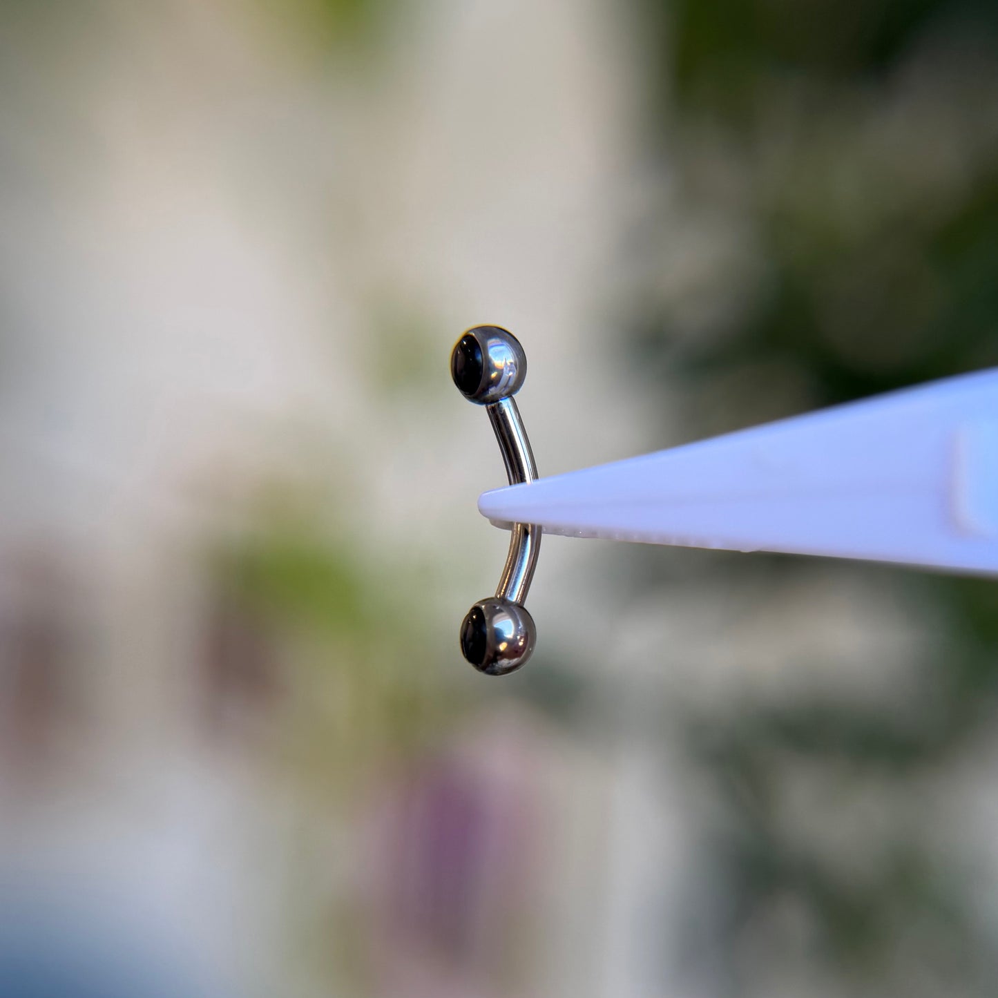 Titanium Cabochon Side Gem Curved Barbell - Onyx