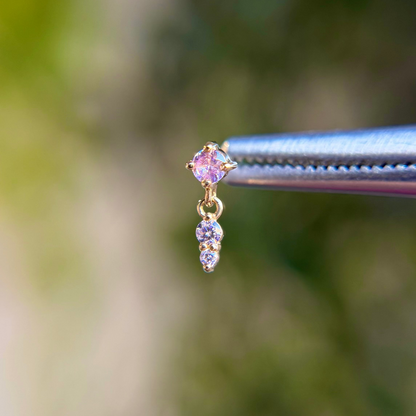 Gold earring with pink gemstone 